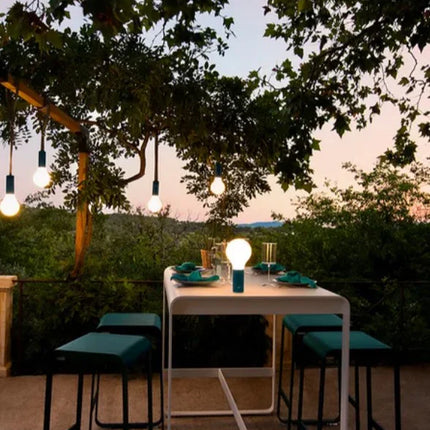  outdoor hospitality furniture with food service setup on a patio.