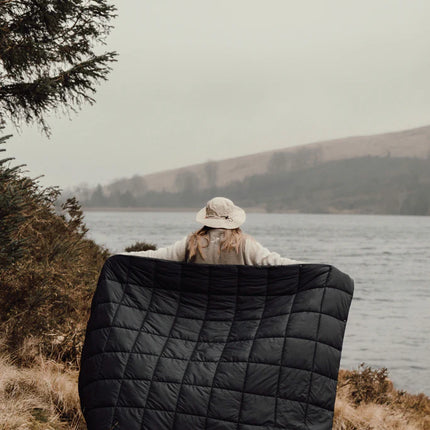  showing its versatile design and cozy fabric for outdoor use.