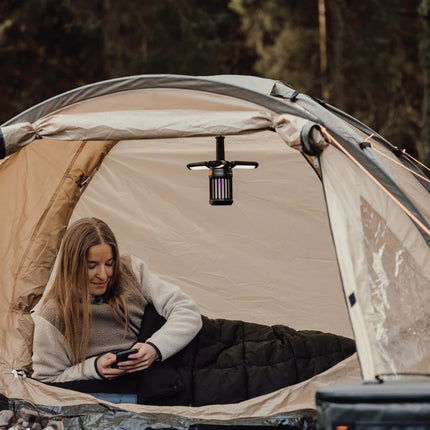  shown spread out with layered sections and outdoor gear in the background.