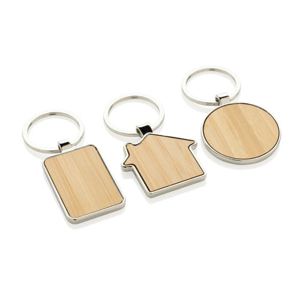 Recycled zinc alloy round keychain with bamboo accent from XD Collection
