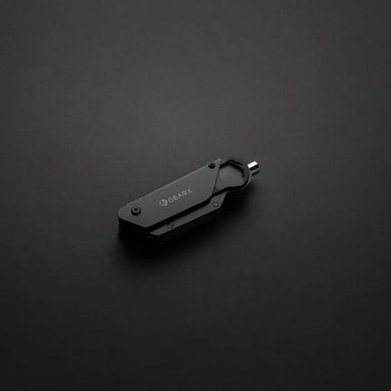  with various wrench and screwdriver attachments on a black background.