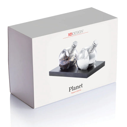 XD Design Planet pepper and salt set with round ceramic shakers featuring colorful planet designs for stylish kitchen storage