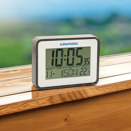 Grundig weatherstation alarm and calendar displaying outdoor weather