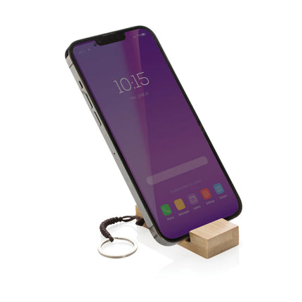XD Collection Standkey bamboo keychain phone stand attached to a smartphone