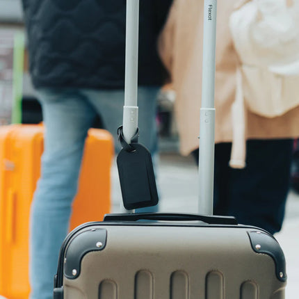  attached to a suitcase in a travel setting
