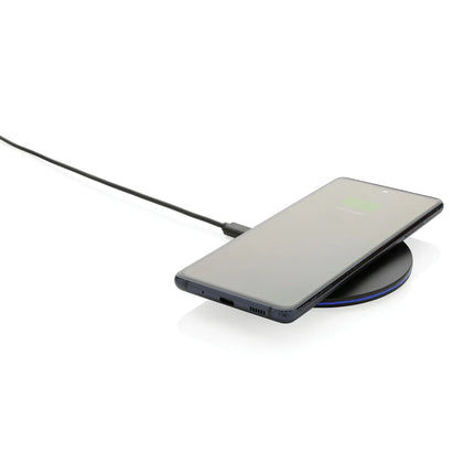  showing the compact charging pad for phones and tablets.