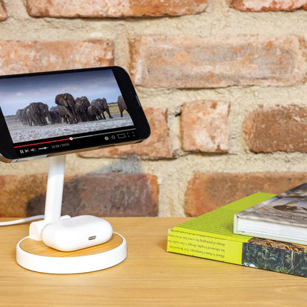  showing the sleek charging stand in use.