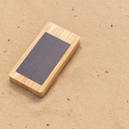 000 mAh bamboo solar powerbank from XD Collection with USB ports and eco-friendly bamboo exterior for phone and tablet charging