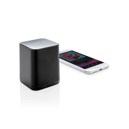  compact audio device with glowing branding and modern design.