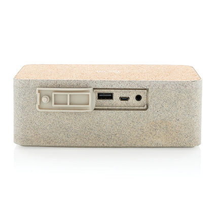  showcasing its compact audio device with charging pad and modern design.