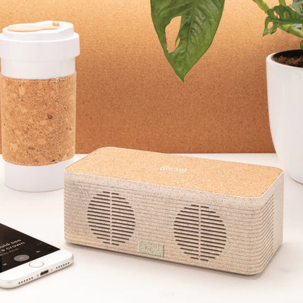  showing the eco-friendly audio device with control buttons and charging pad.