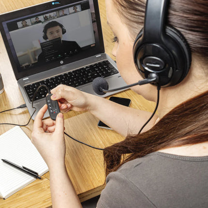 Over-ear wired work headset from XD Collection with cushioned ear cups and adjustable headband for comfortable audio communication.