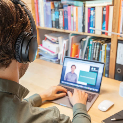  showing black over-ear design with padded ear cups and adjustable headband.