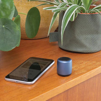  compact portable audio device with sleek metallic finish.