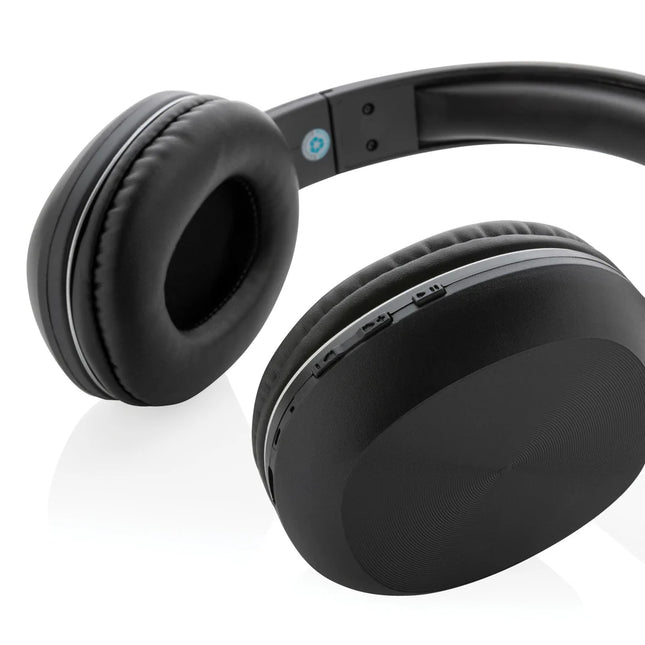  sleek black audio device with ear cushions and wireless control buttons.