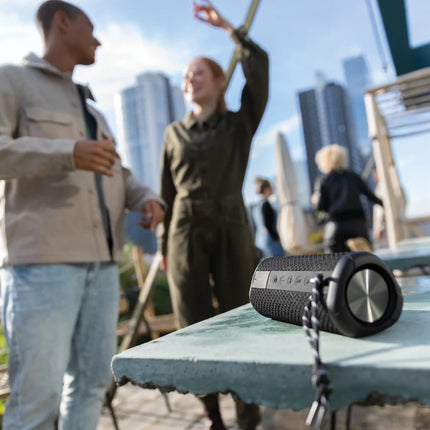 Urban Vitamin IPX7 waterproof 10W portable speaker shown with rugged design and control buttons on top.