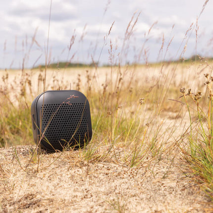  eco-friendly design with control buttons and speaker grille.