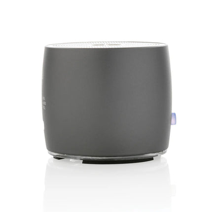  compact audio device with sleek design and visible speaker grille.