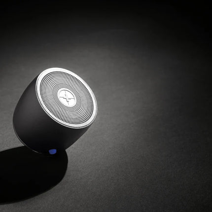  compact portable audio device with sleek design and bass enhancement features.