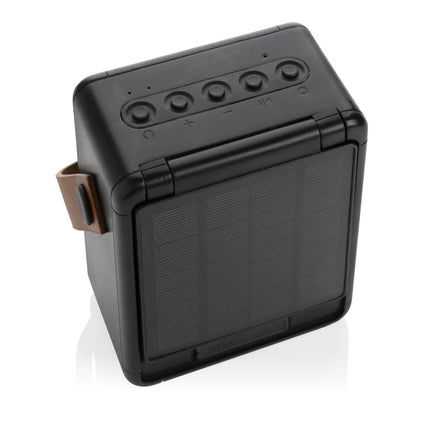  12W portable outdoor audio device with solar panel and durable design.