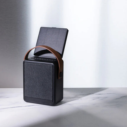 12W portable audio device with solar charging and eco-friendly design.