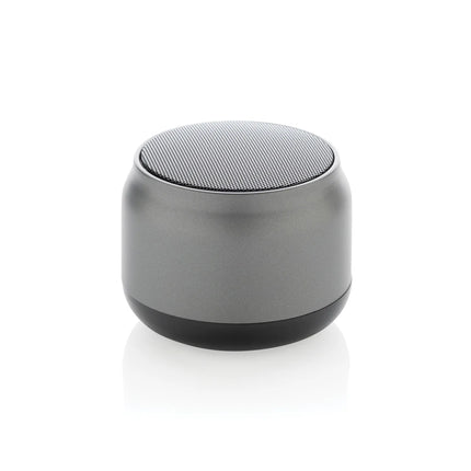 XD Collection BeatBuddy recycled plastic 3W audio speaker showing a compact black design with textured surface and port openings.