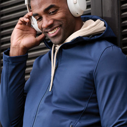  close-up of black over-ear audio headphones with control buttons.
