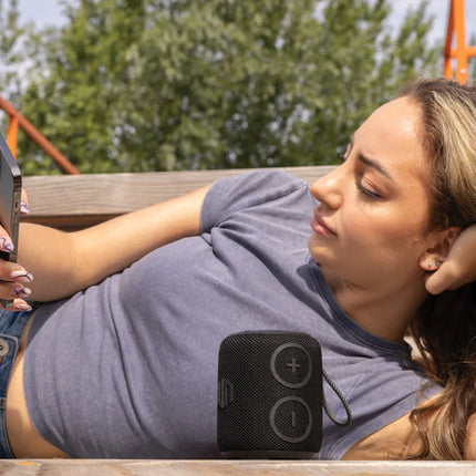  compact audio device with rugged design and built-in controls.