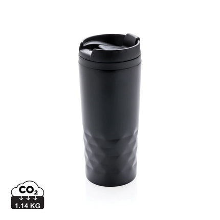 Geometric-shaped XD Collection drinkware mug with black and white modern geometric pattern.