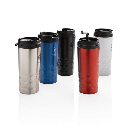 Geometric XD Collection drinkware mug with black and white geometric pattern on ceramic surface.