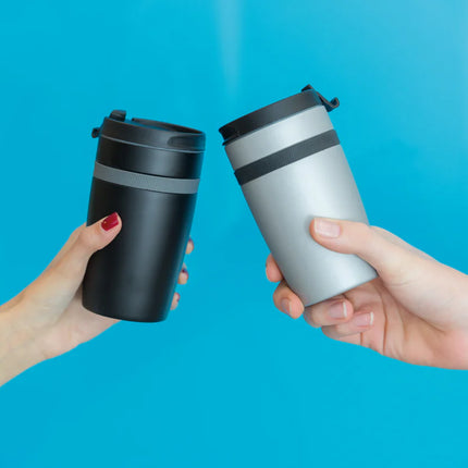  showing insulated stainless steel drinkware with lid and sleek design.