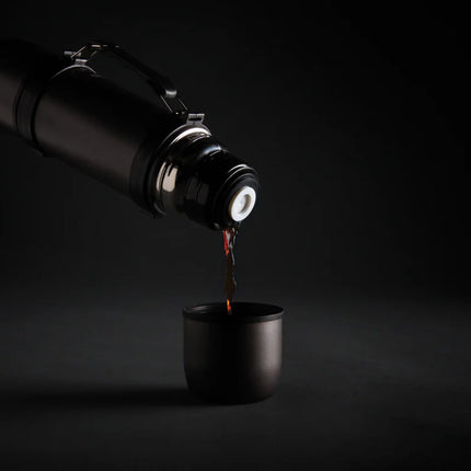  shown with the flask and cups.