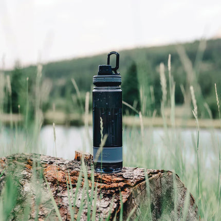 Swiss Peak Tritan water bottle in clear drinkware with a black lid