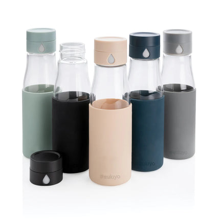  clear drinkware for water with measurement markings and protective sleeve.
