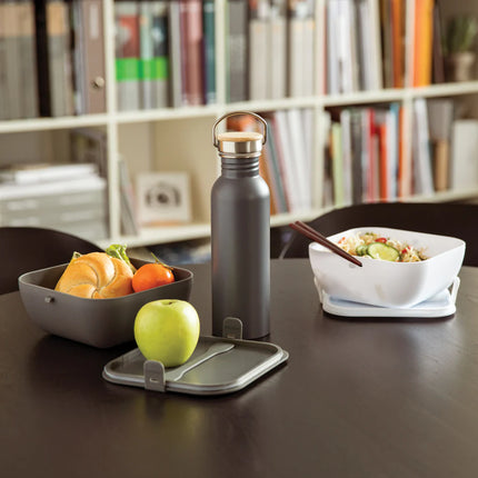  showing the sleek bottle with bamboo cap.