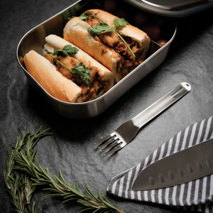 Large Black + Blum stainless steel lunch box with multiple compartments for home and living use.