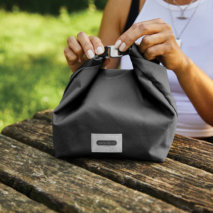Black + Blum 6.7L insulated outdoor lunch and cooler bag with black exterior and zip closure