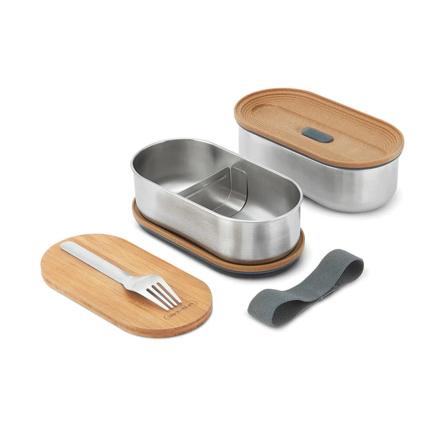 Stainless steel double bento box by Black + Blum with two compartments for home and lunch storage.