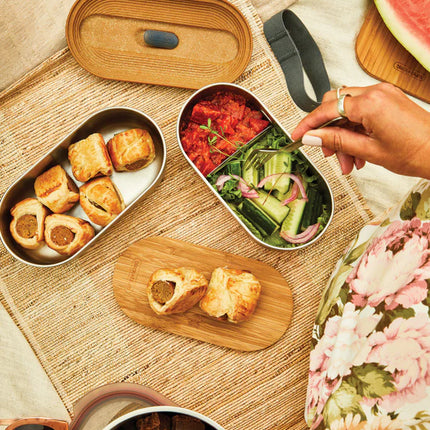  featuring two compartments for home and lunch storage.