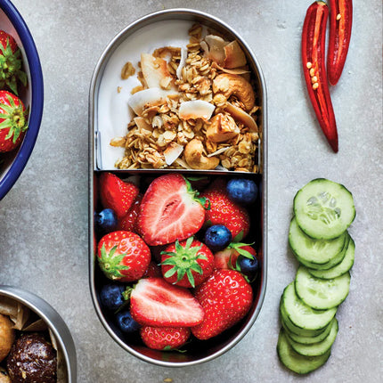Stainless steel double bento box by Black + Blum with two compartments for home and lunch storage.
