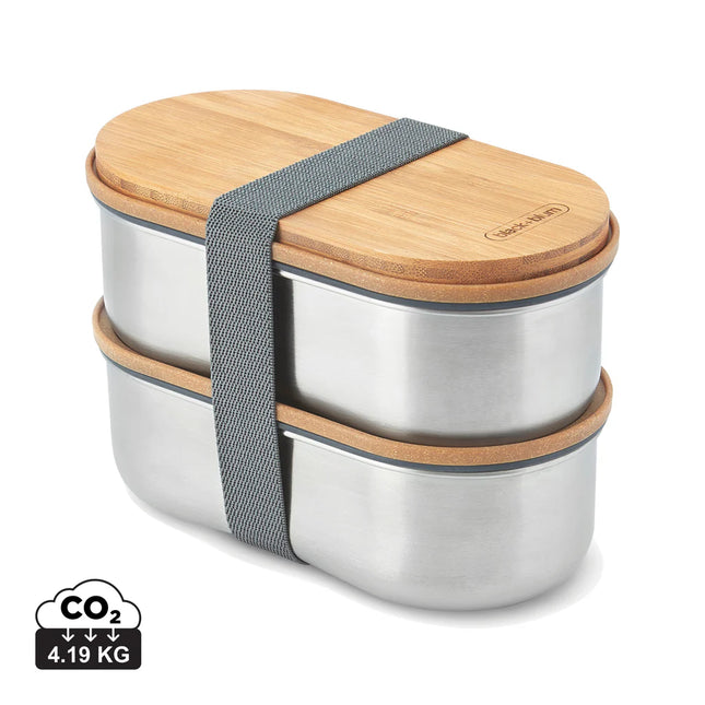 Stainless steel double bento box by Black + Blum with two compartments for home and lunch storage.