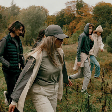  showing the eco-friendly headwear with curved brim and adjustable strap.
