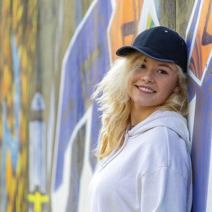  showing the headwear with contrasting panels and structured design.
