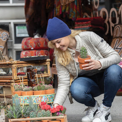  showcasing its cozy knit headwear design.