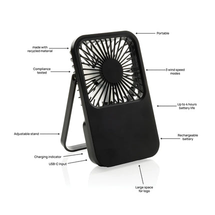 shown on a desk with a phone and tablet nearby.