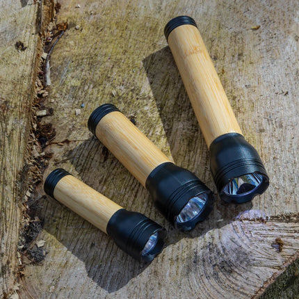 XD Collection Lucid 3W RCS certified recycled plastic and bamboo torch for outdoor lighting and camping use.