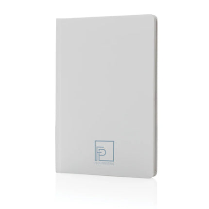 A5 Impact stone paper hardcover notebook from XD Collection with a sleek black cover and visible spiral binding.