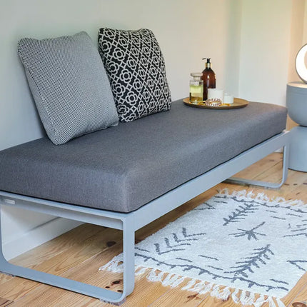  featuring a round seat and four sturdy legs.