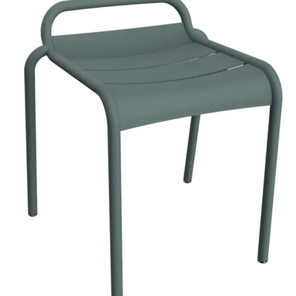 White Fermob Luxembourg outdoor dining stool with a sleek