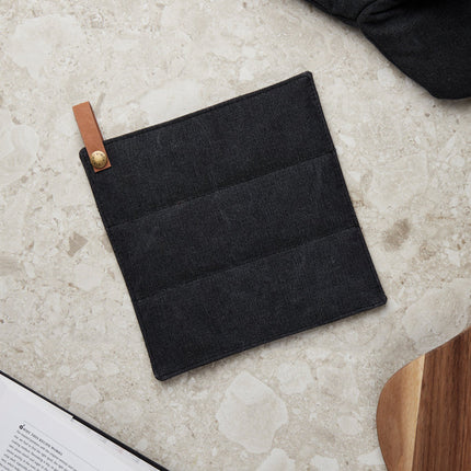 Vinga Asado stonewashed canvas potholder from the Home & Living collection, showing a durable, textured fabric potholder in natural tones.